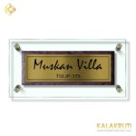 Muskan Villa Brown stone with glass with Brass SS Etching